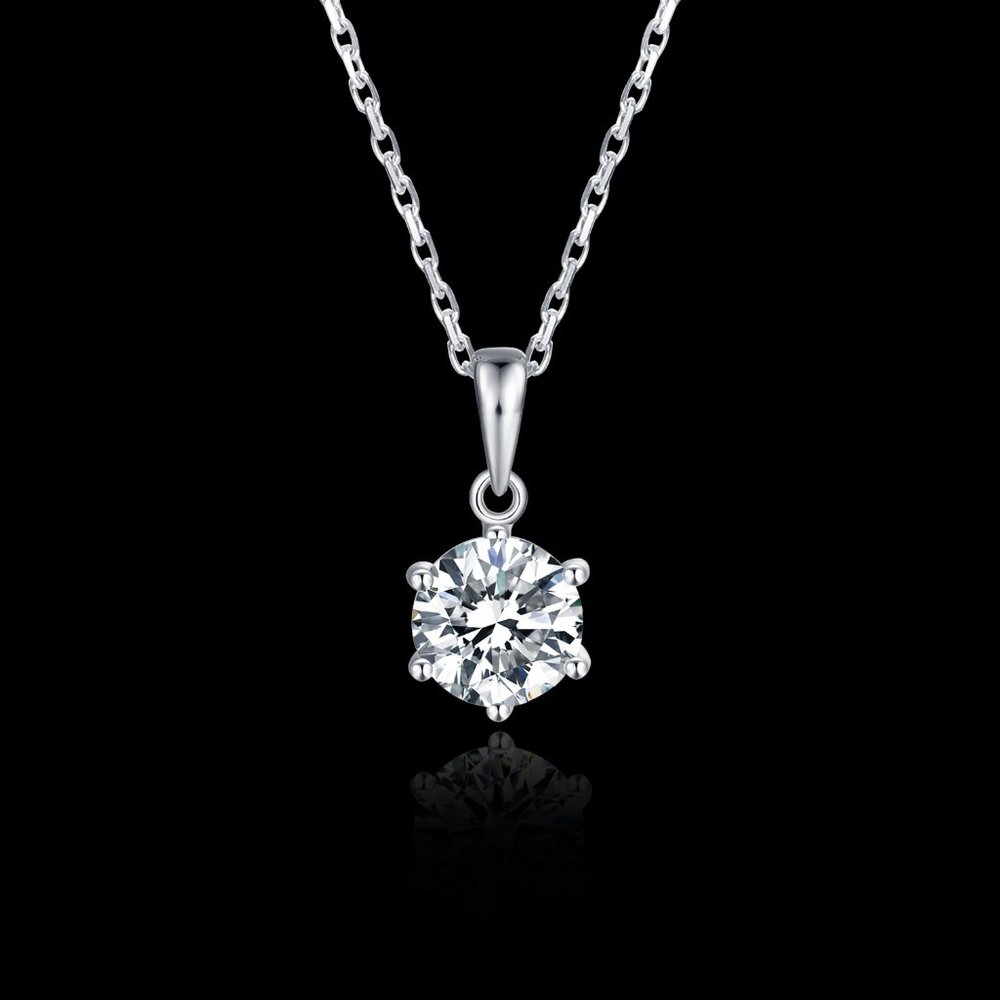 A Moissanite Diamond Solitaire shines at this delicate Sterling Silver Pendant.